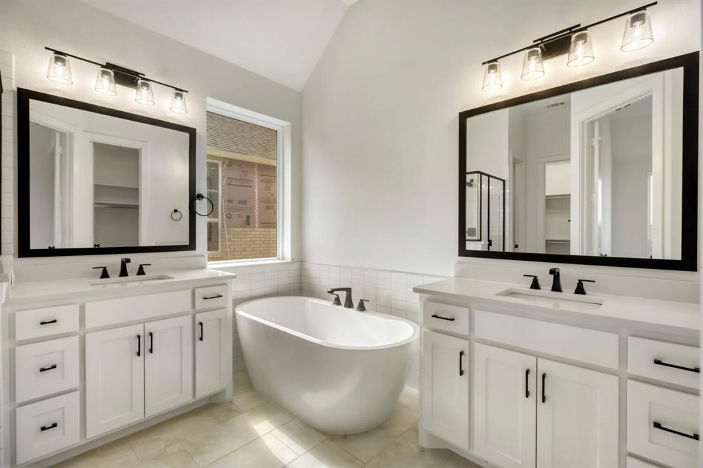 4312 Double Diamond Prosper, TX 75078 - Photo 15 of 29 a bathroom with double vanity sinks and a mirror