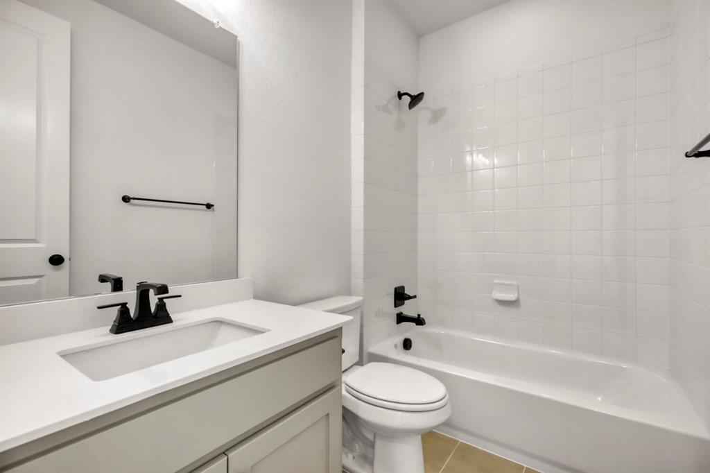 4312 Double Diamond Prosper, TX 75078 - Photo 23 of 29 a bathroom with a sink and a bathtub