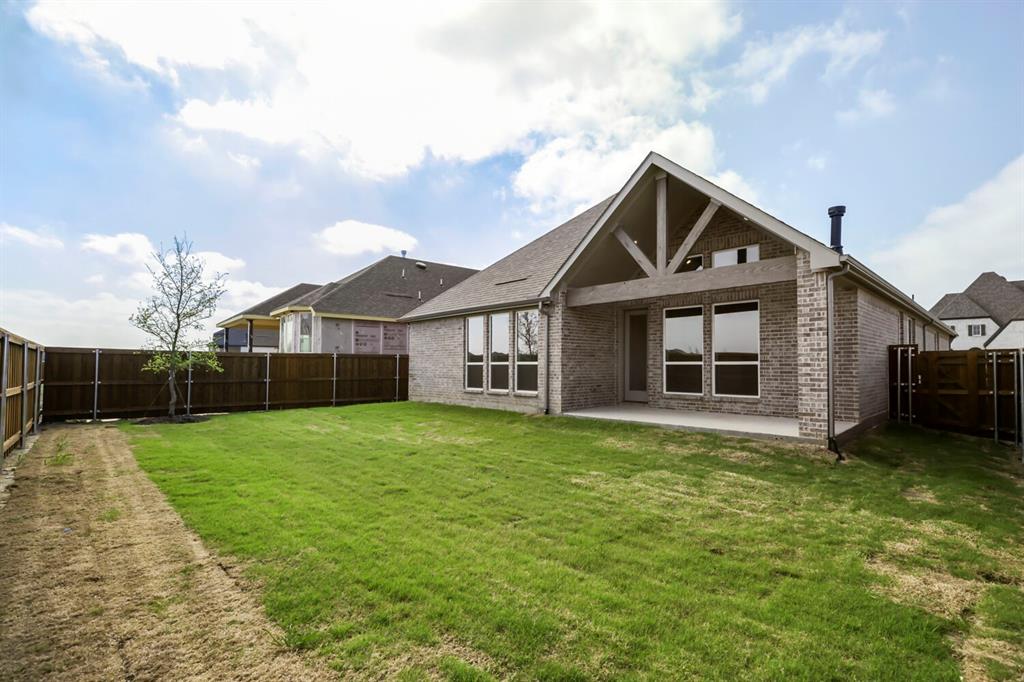 4312 Double Diamond Prosper, TX 75078 - Photo 27 of 29 a front view of a house with a yard and garage