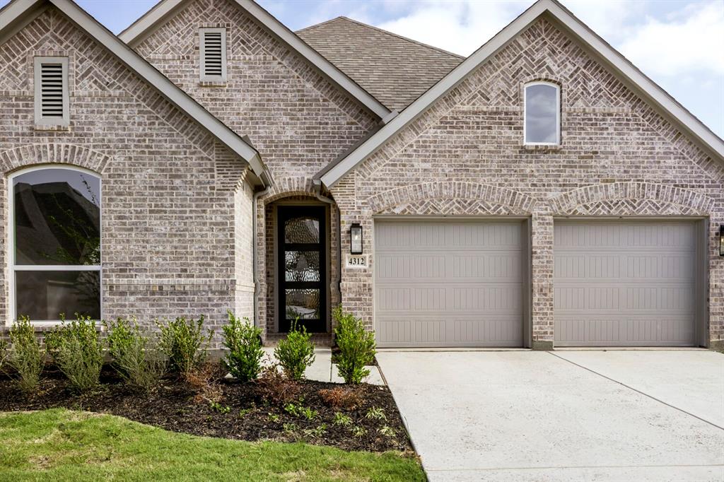 4312 Double Diamond Prosper, TX 75078 - Photo 28 of 29 a front view of a house with garden