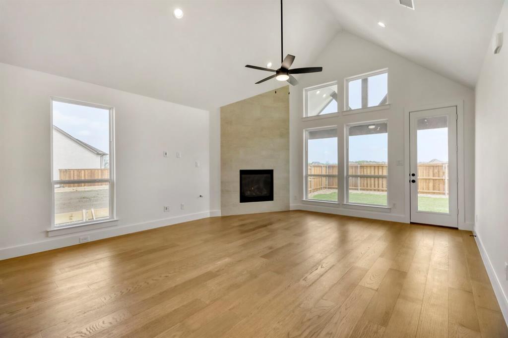 4312 Double Diamond Prosper, TX 75078 - Photo 5 of 29 a view of an empty room with a window and wooden floor