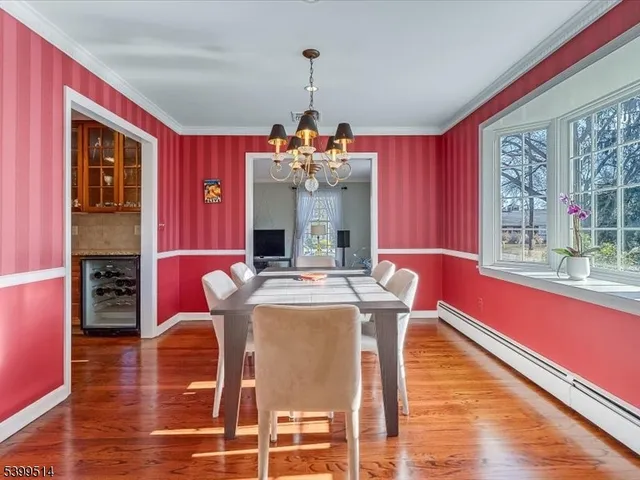 a kitchen with stainless steel appliances granite countertop wooden cabinets a sink and a stove