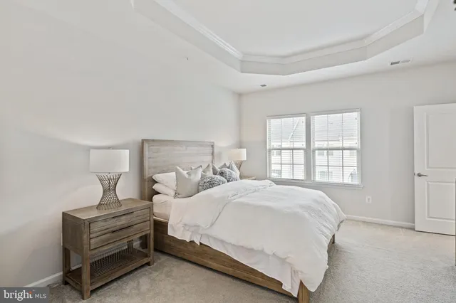 a bedroom with a bed and flat screen tv