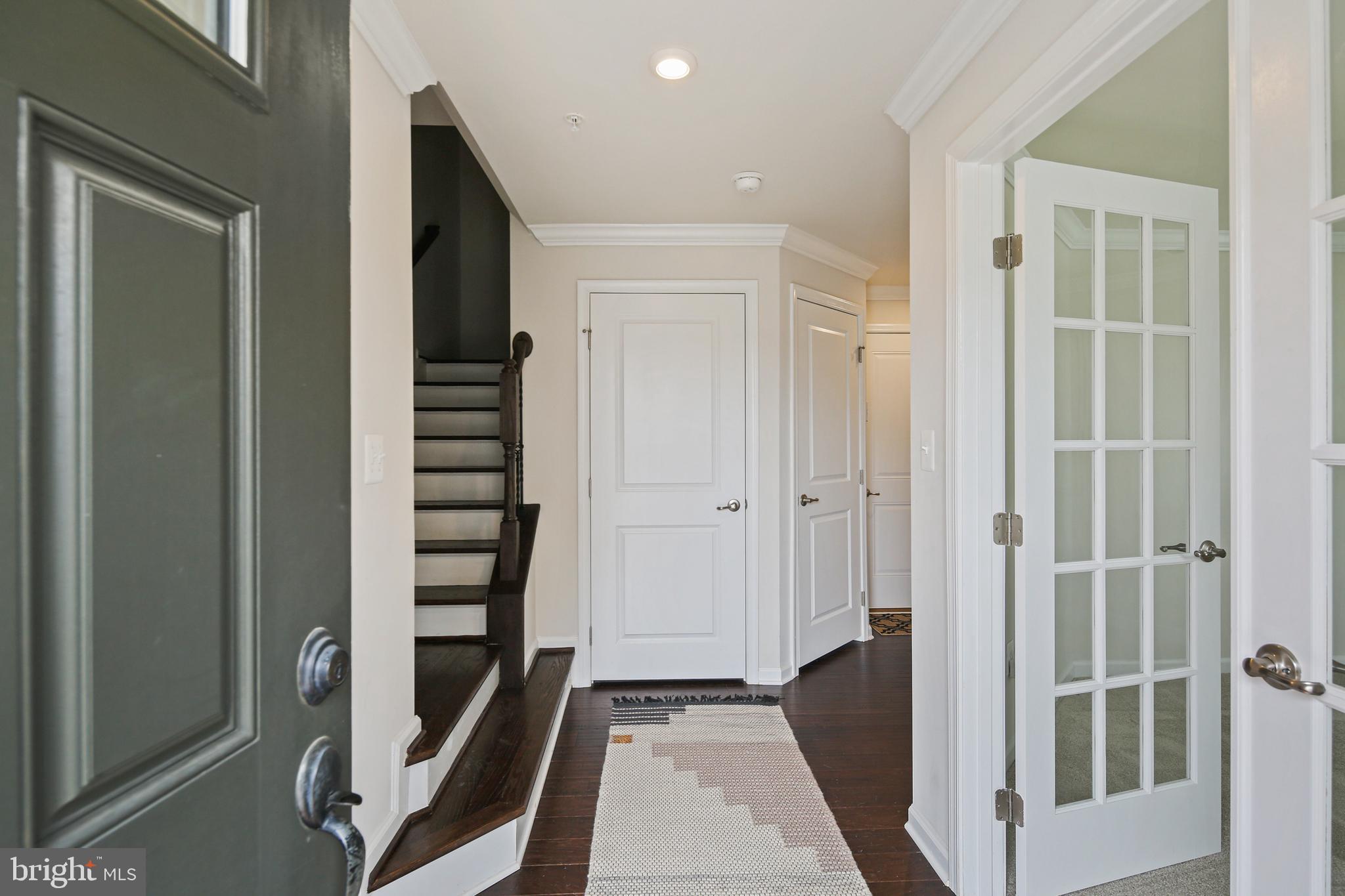 10012 Sandy Run Road Baltimore, MD 21220 - Photo 10 of 34 a view of a hallway with wooden floor and staircase