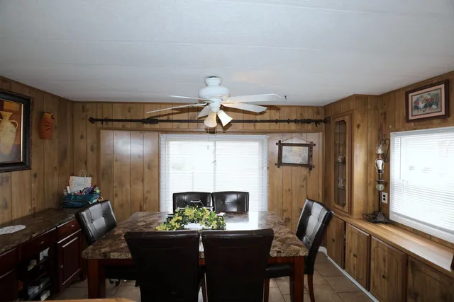 a dining room with furniture and window
