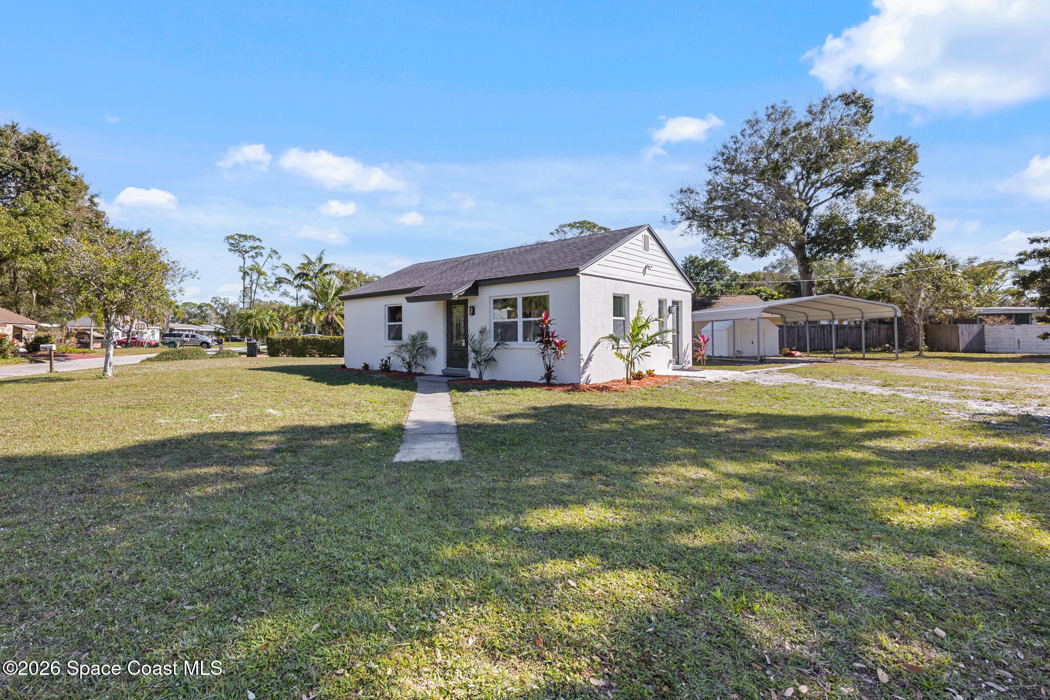 a view of a house with a big yard