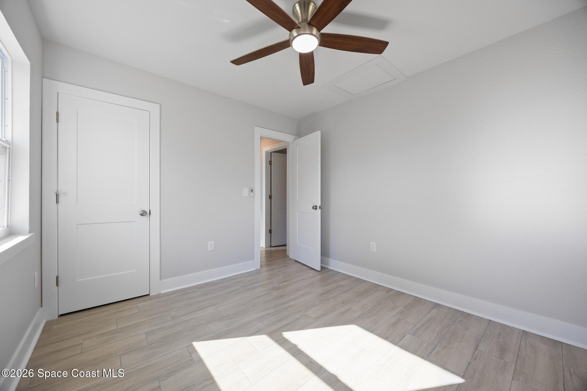 1113 Pinedale Road Rockledge, FL 32955 - Photo 11 of 19 an empty room with closet and a chandelier fan