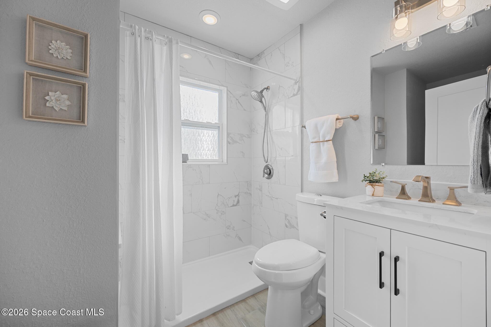 1113 Pinedale Road Rockledge, FL 32955 - Photo 13 of 19 a bathroom with a granite countertop sink toilet and shower