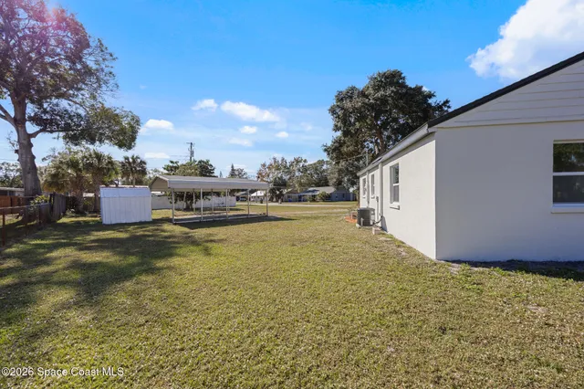 a house view with swimming pool in front of it
