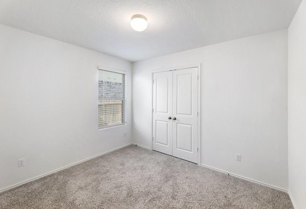 21416 Bird Wing Drive Pflugerville, TX 78660 - Photo 18 of 25 a view of an empty room with a window