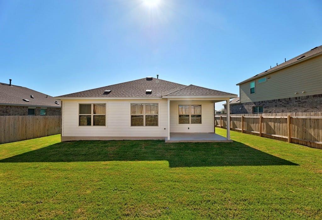 21416 Bird Wing Drive Pflugerville, TX 78660 - Photo 20 of 25 a front view of a house with a garden