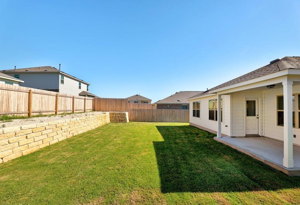 21416 Bird Wing Drive Pflugerville, TX 78660 - Photo 24 of 25 a front view of a house with garden