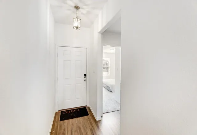 a kitchen with stainless steel appliances kitchen island granite countertop a refrigerator stove and sink