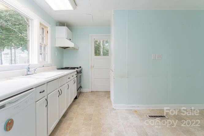 2853 Chimney Rock Road Hendersonville, NC 28792 - Photo 11 of 36 a bathroom with a sink a vanity and a large mirror