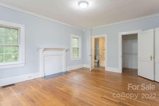 2853 Chimney Rock Road Hendersonville, NC 28792 - Photo 15 of 36 an empty room with wooden floor and windows