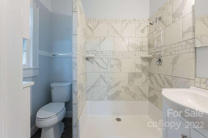 2853 Chimney Rock Road Hendersonville, NC 28792 - Photo 18 of 36 a bathroom with a toilet and a shower