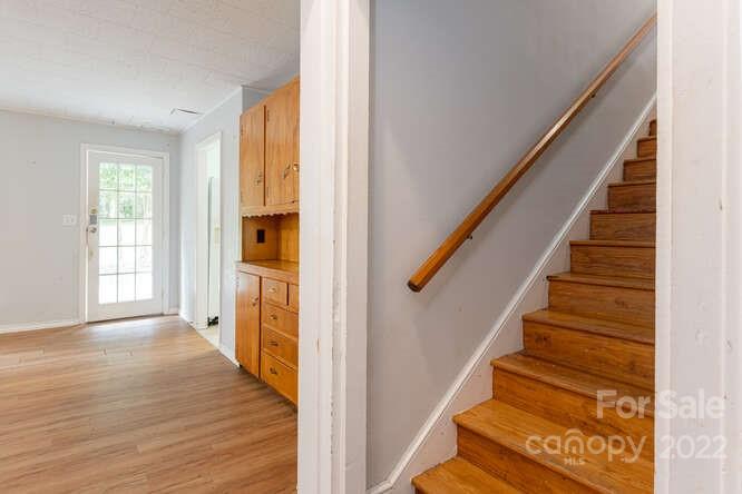 2853 Chimney Rock Road Hendersonville, NC 28792 - Photo 19 of 36 a view of an entryway with wooden floor and stairs