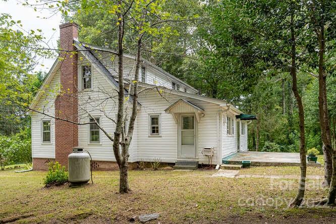 2853 Chimney Rock Road Hendersonville, NC 28792 - Photo 2 of 36 a view of a house with backyard and sitting area