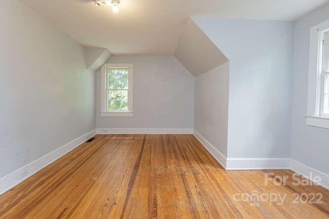 2853 Chimney Rock Road Hendersonville, NC 28792 - Photo 25 of 36 wooden floor in an empty room with a window