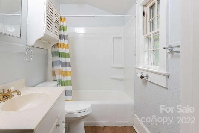 2853 Chimney Rock Road Hendersonville, NC 28792 - Photo 27 of 36 a bathroom with a sink toilet and shower