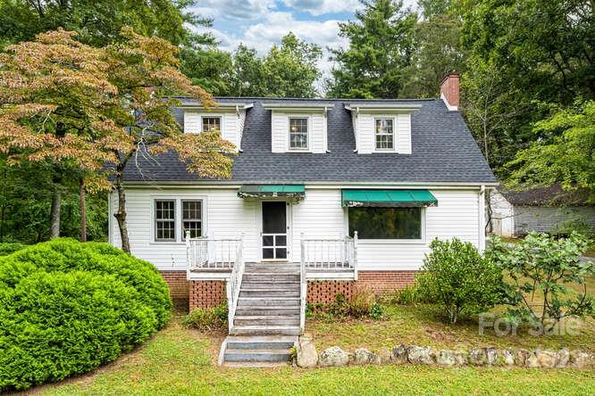 2853 Chimney Rock Road Hendersonville, NC 28792 - Photo 29 of 36 a front view of a house with garden