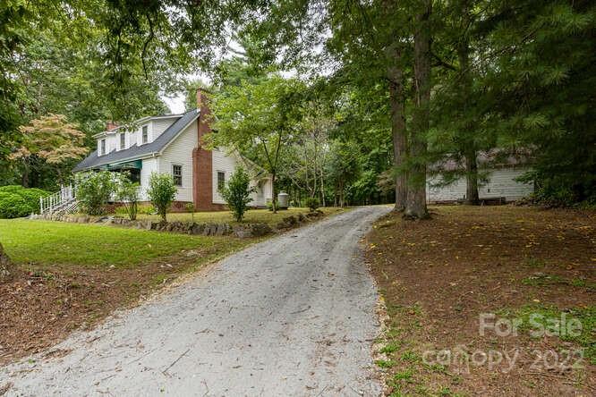 2853 Chimney Rock Road Hendersonville, NC 28792 - Photo 33 of 36 a view of a house with a yard