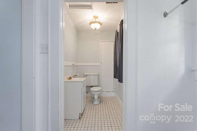 2853 Chimney Rock Road Hendersonville, NC 28792 - Photo 9 of 36 a bathroom with a toilet