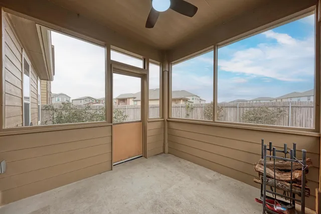 a view of room with window and furniture