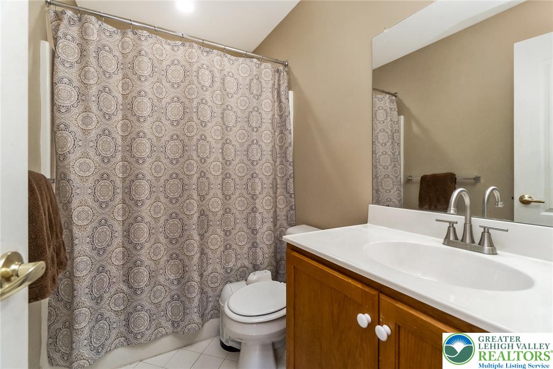 3566 Penfield Way Nazareth, PA 18064 - Photo 38 of 47 A well-lit bathroom features a vanity with a white countertop..