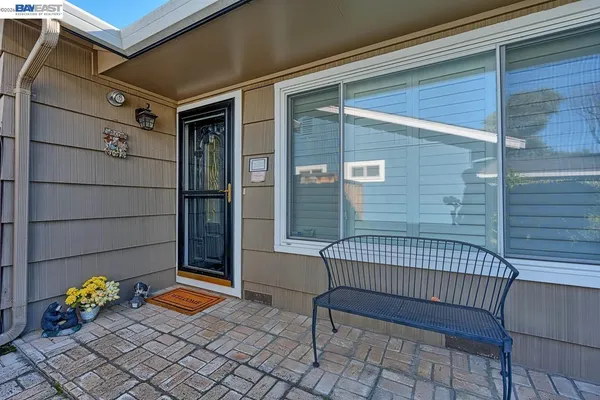 a view of a porch with a bench