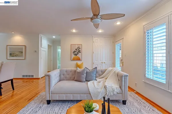a view of a patio with table and chairs and potted plants