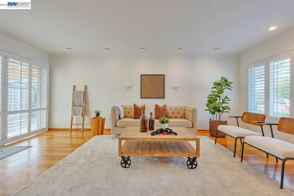 a living room with furniture and a table