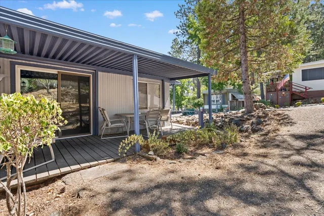 a outdoor space with chairs a table and chairs