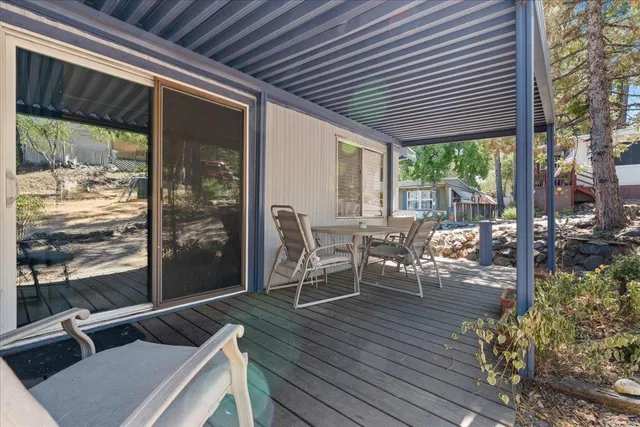 a patio with table and chairs