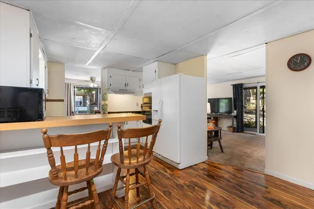 a kitchen with sink cabinets and stove