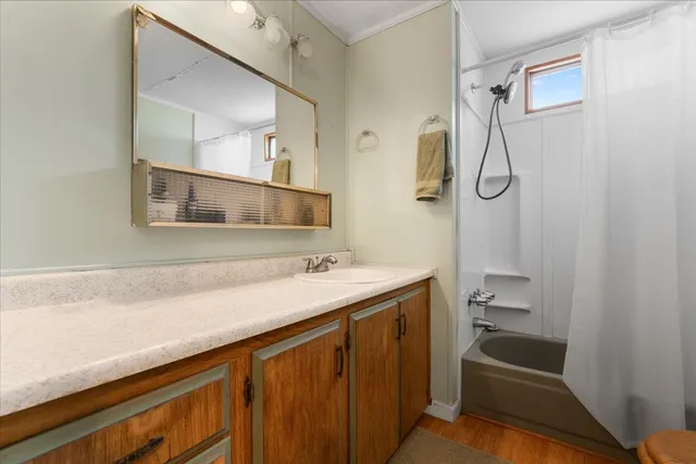 a view of a bedroom with bathroom