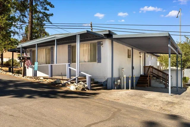 a front view of a house with a garage