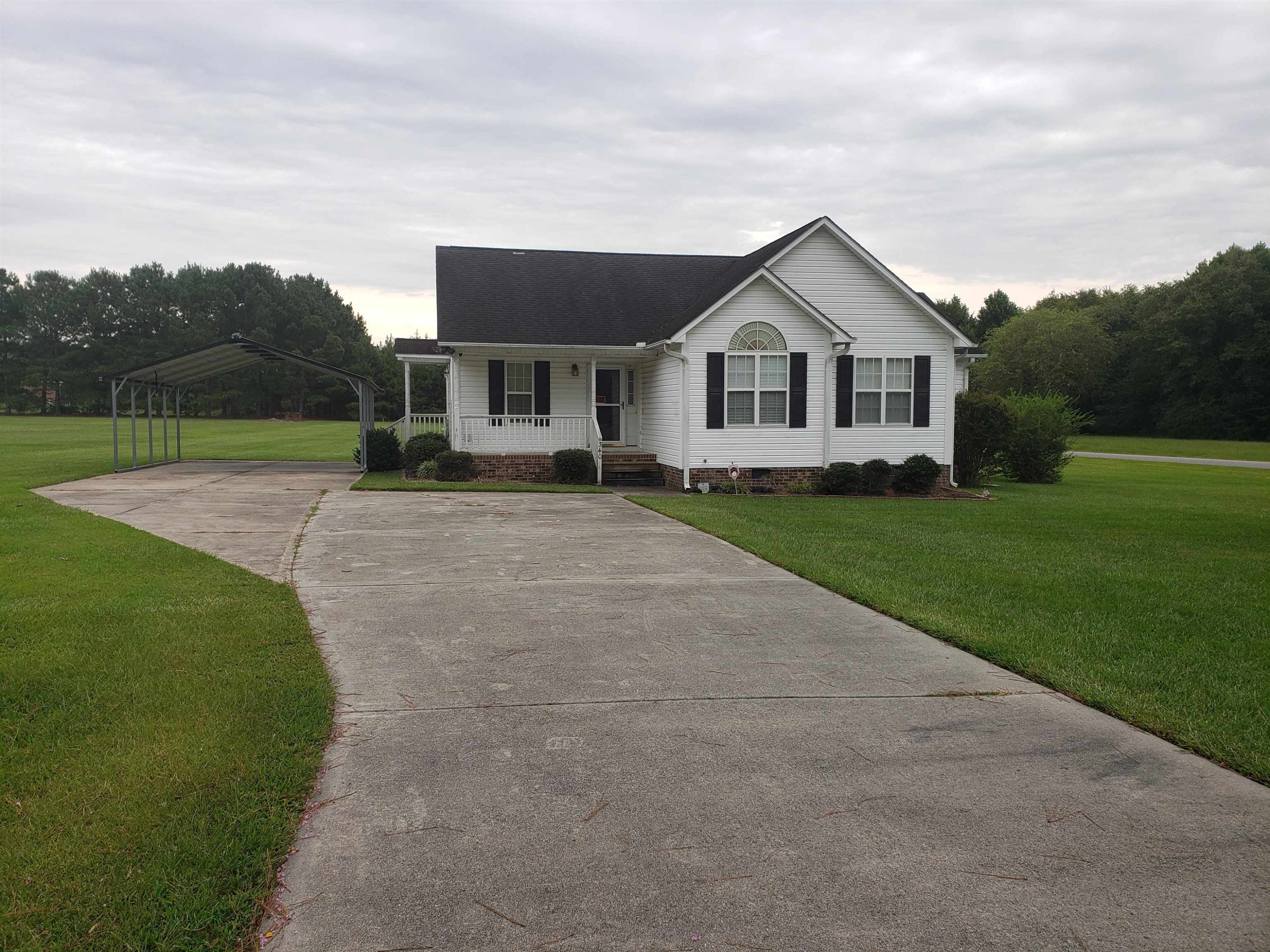 340 Parrish Memorial Road Selma, NC 27576 - Photo 1 of 17 a front view of a house with yard