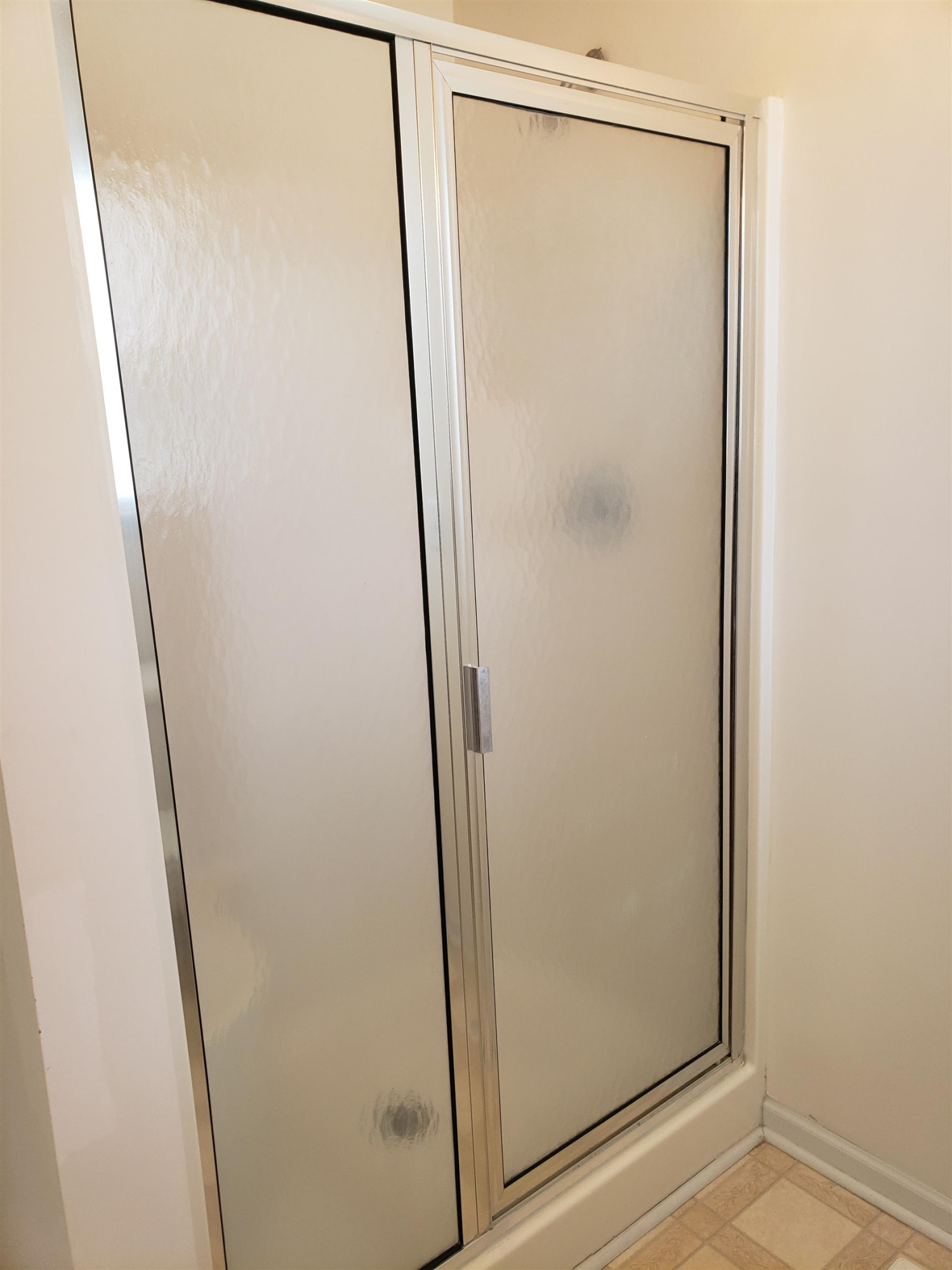 340 Parrish Memorial Road Selma, NC 27576 - Photo 13 of 17 a bathroom with a glass shower door