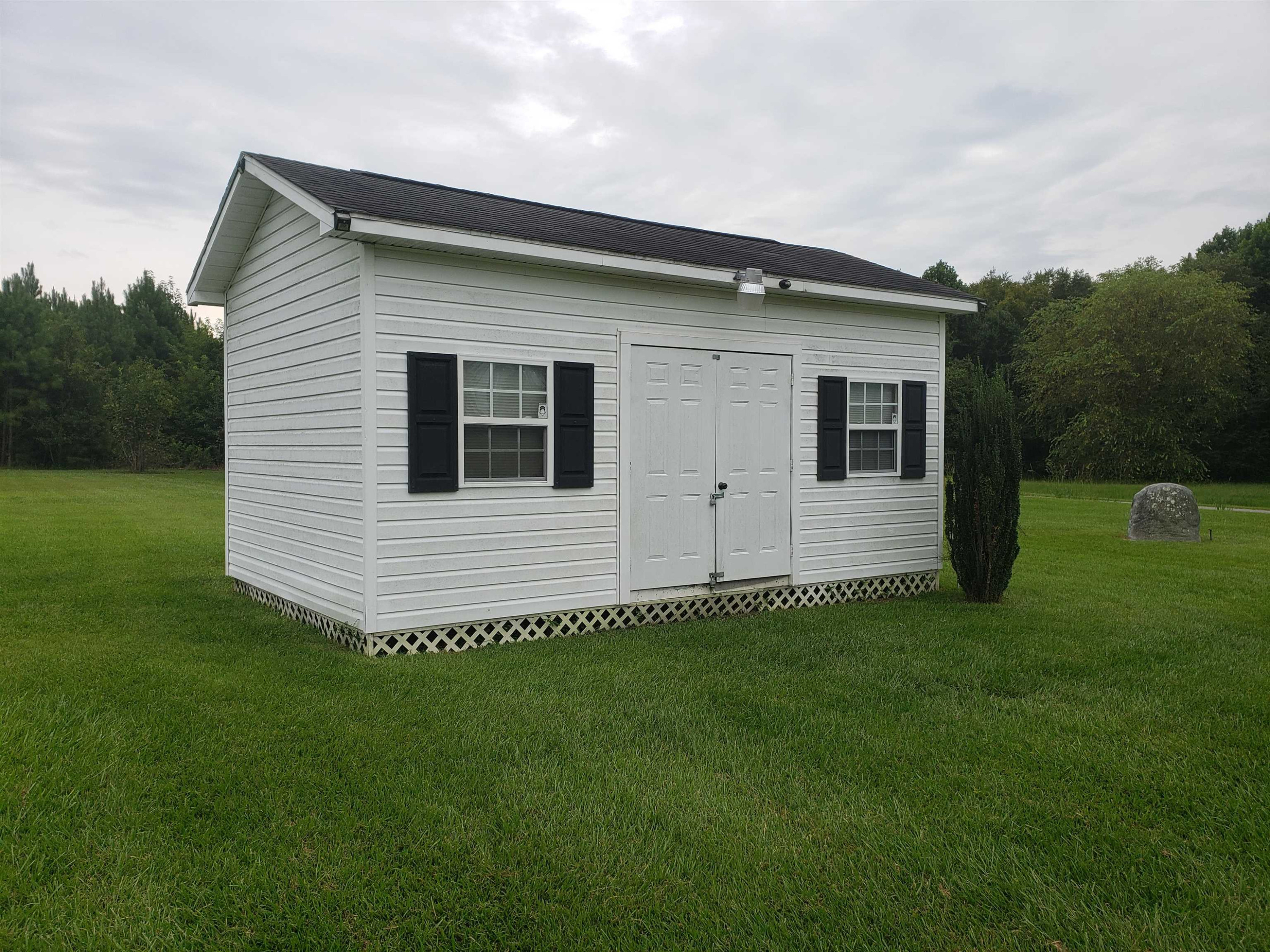 340 Parrish Memorial Road Selma, NC 27576 - Photo 15 of 17 a view of a house with a backyard