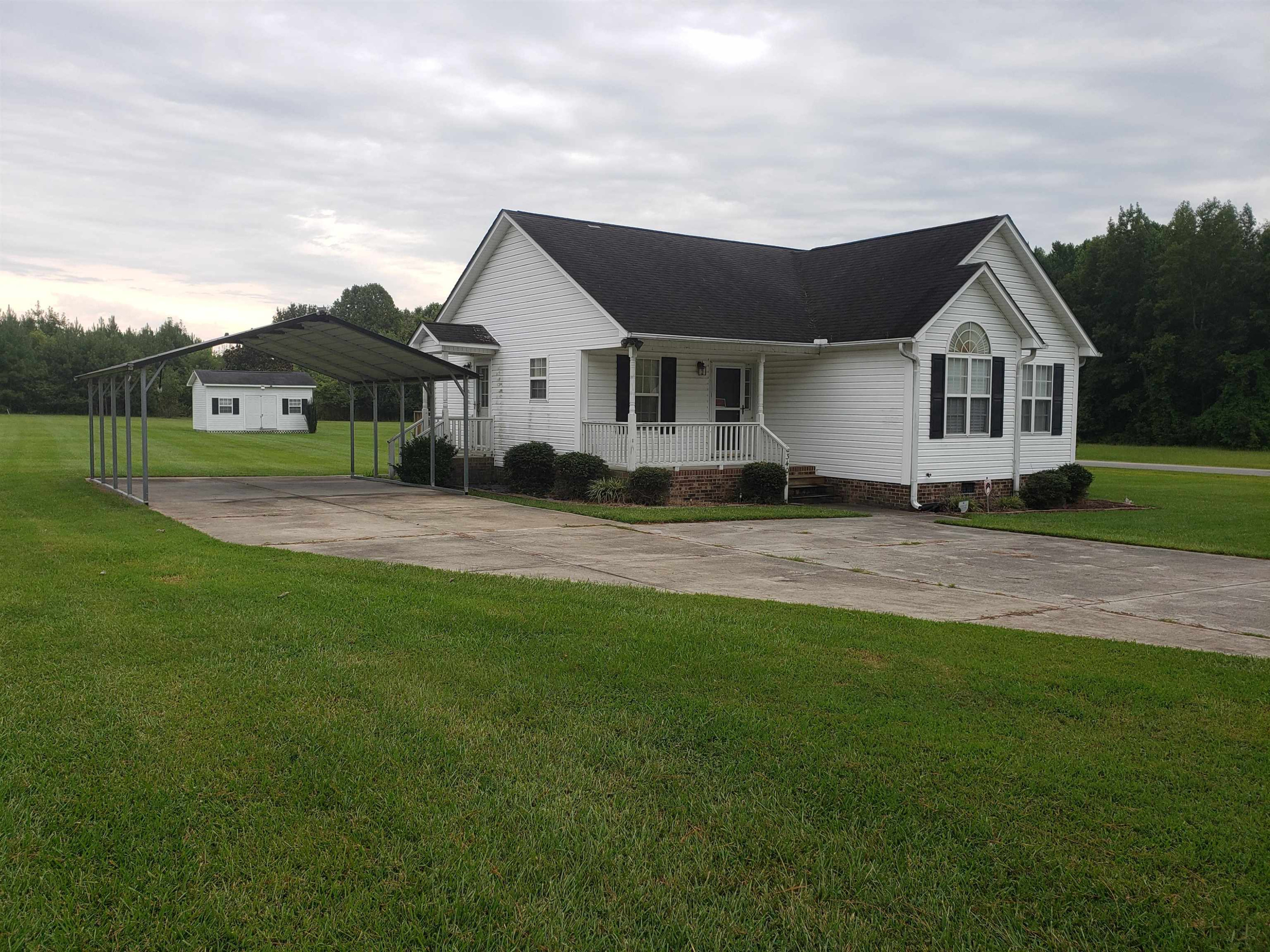 340 Parrish Memorial Road Selma, NC 27576 - Photo 2 of 17 a front view of a house with a yard