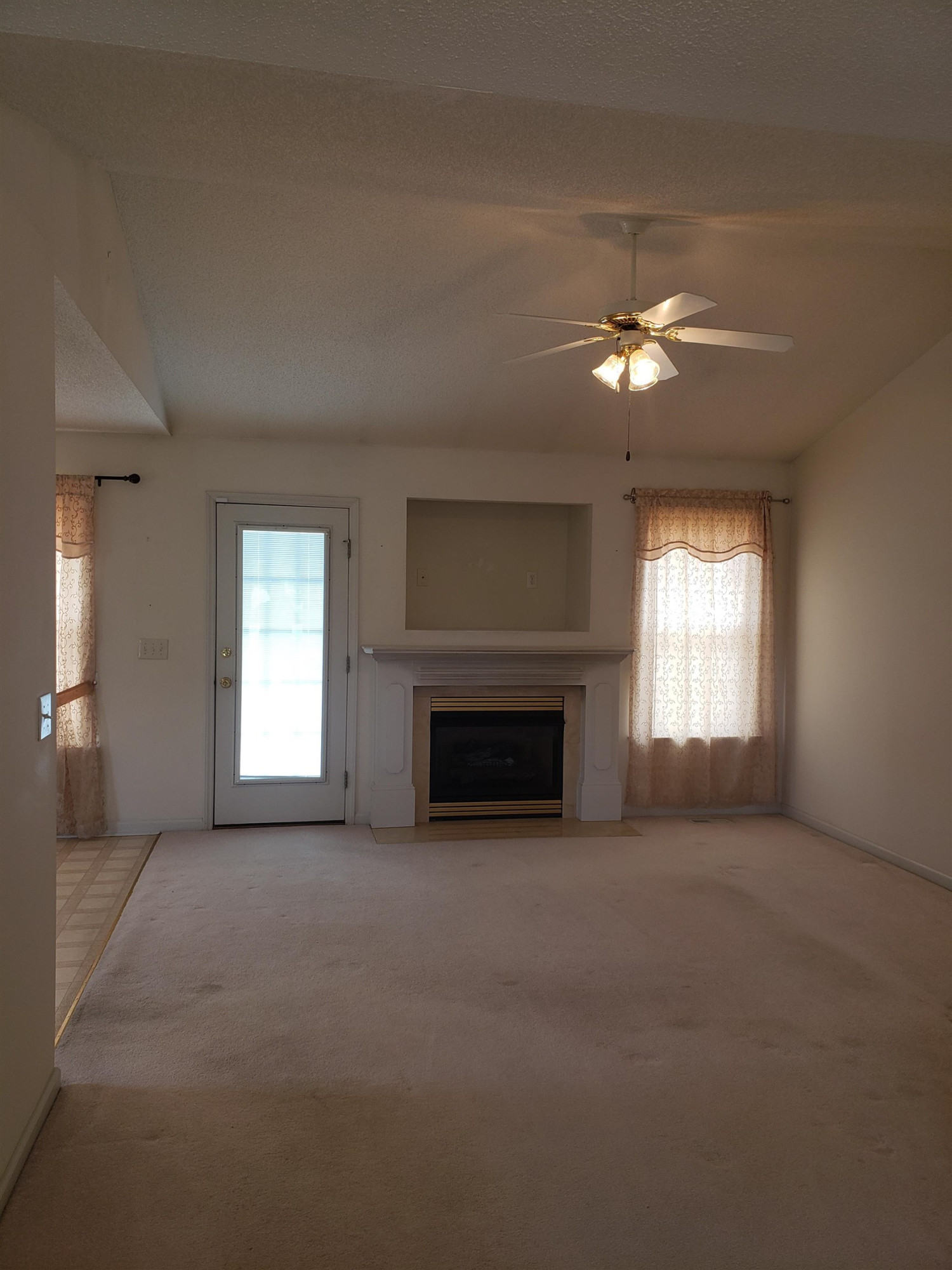 340 Parrish Memorial Road Selma, NC 27576 - Photo 4 of 17 a view of empty room with a fireplace