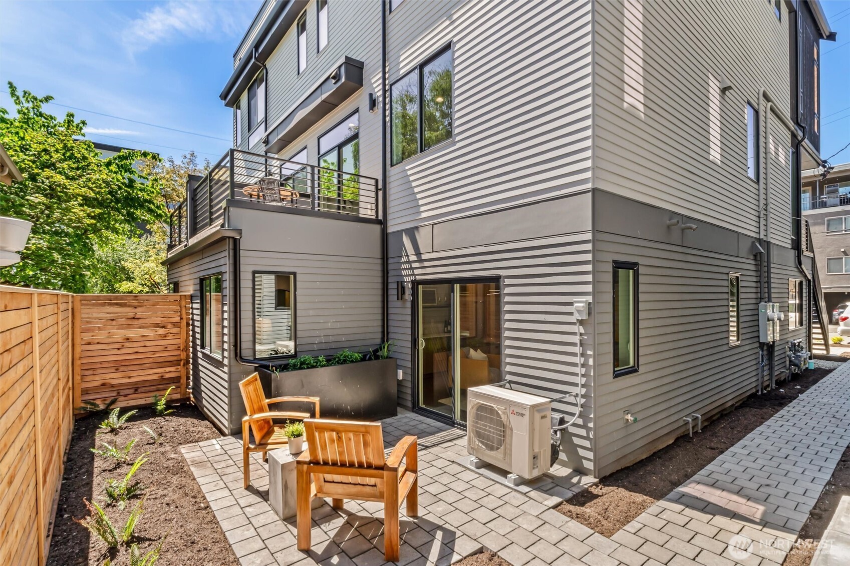 4460 Midvale Avenue North Seattle, WA 98103 - Photo 32 of 40 a view of a patio with table and chairs and potted plants