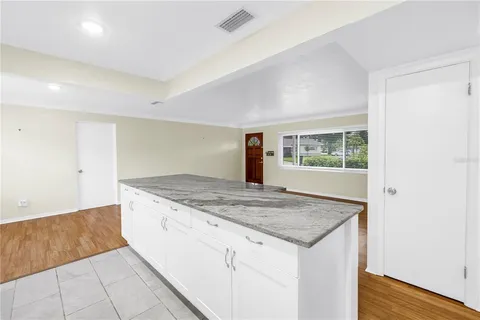 a kitchen with a stove and a kitchen island