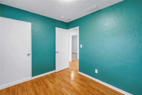 a view of a room that has a window in it