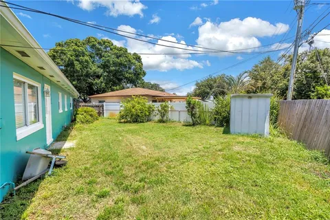 a view of a house with a yard and garage