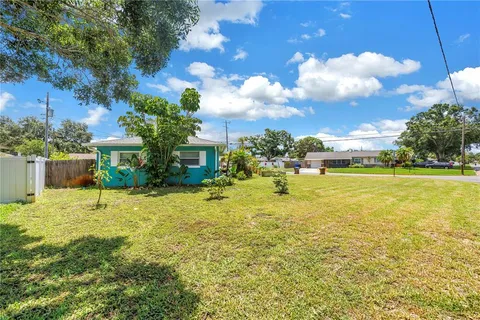 a view of a back yard of the house