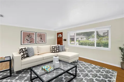 a living room with furniture and a window