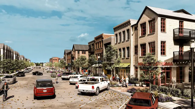 a city street lined with parked cars and buildings
