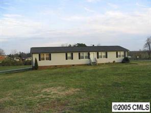 5151 Crouse Road Crouse, NC 28033 - Photo 1 of 8 a front view of a house with a garden
